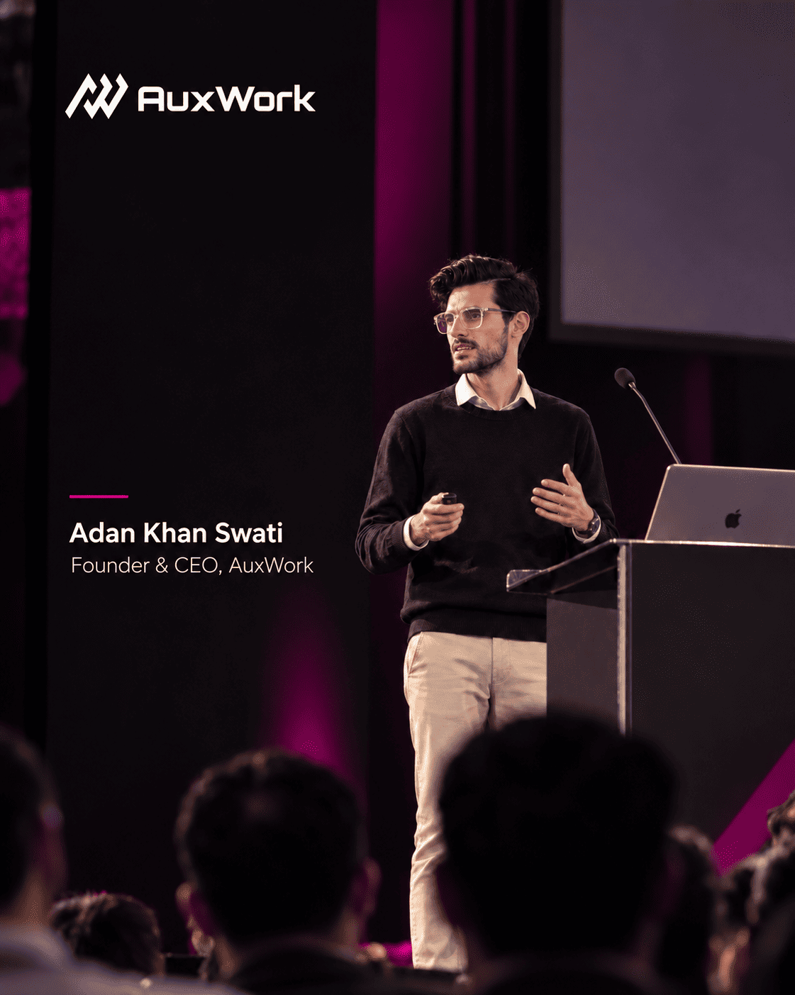 Adan Khan Swati, Co-Founder & CEO of AuxWork, speaking on stage